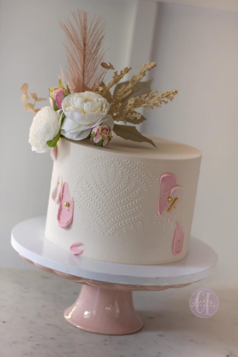 Boho-inspired 8" Buttercream Bridal Shower Cake: A chic and abstract design featuring buttercream, perfect for a bohemian-inspired bridal celebration. The cake showcases a blend of textures and patterns, adding a touch of artistic elegance to the festivities