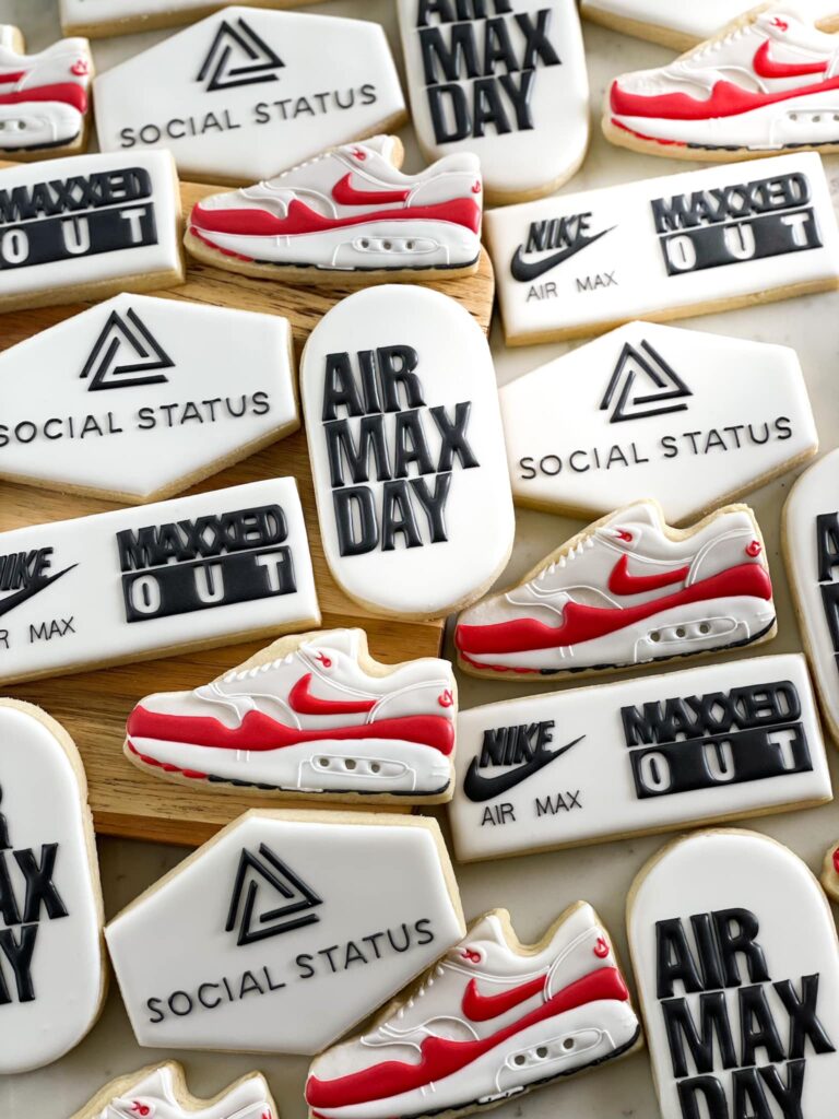 Nike Air Max Day Cookies: Artfully crafted and modern cookies celebrating Air Max Day. Detailed designs replicate the requested sneakers, featuring the Social Status logo and Air Max Day logo. These delicious treats capture the essence of sneaker culture in a tasteful and edible display