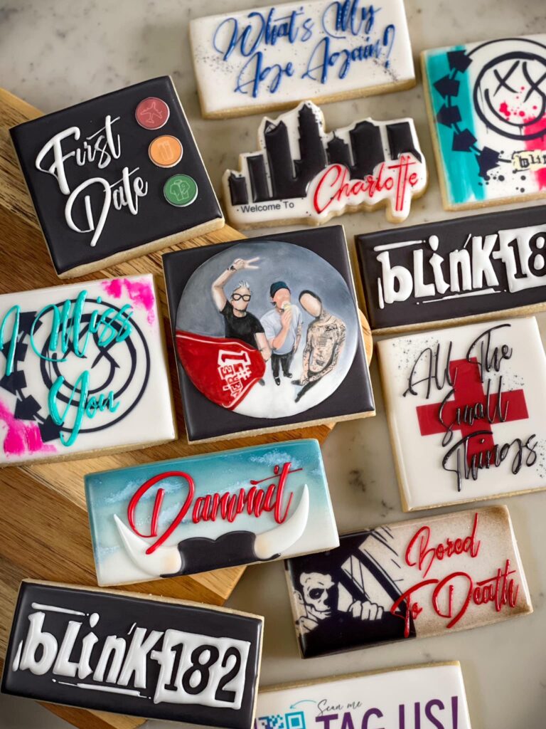 Blink-182 Cookies for Charlotte Show: Artfully crafted treats featuring hand-painted images of the three band members, alongside detailed representations of their albums and songs. These cookies are a sweet celebration of Blink-182's performance in Charlotte, capturing the essence of their music through edible art